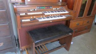 A mid 20th century manual organ with stool.