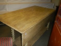 A good quality heavy painted drop leaf dining table with barley twist legs, COLLECT ONLY.