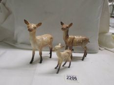 Two Beswick deer and a Beswick faun, in good condition.