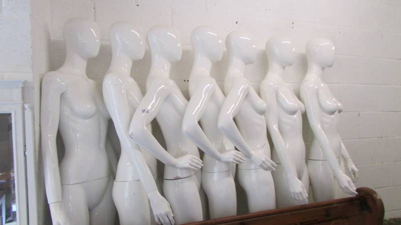 Seven shop manikins with four bases. COLLECT ONLY.