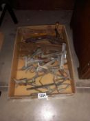 A quantity of vintage mole traps and ice skates & cast iron bean slicer