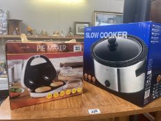 A Tesco slow cooker and a prolectrix pie maker, both boxed