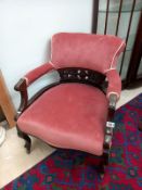 A carved wood frame upholstered low armchair COLLECT ONLY
