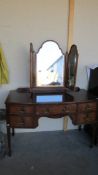 A mahogany bow front dressing table. COLLECT ONLY.