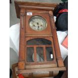 An early 20th century oak wall clock in working order, COLLECT ONLY.