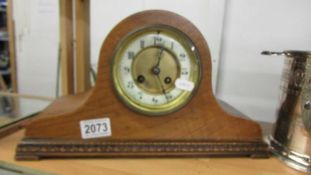 An oak eight day mantel clock.