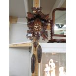 A Black Forest Cuckoo clock with original purchase receipt.