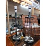 A pair of black spiral cage table lamps