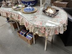 A French style curved dressing table with cloth apron and glass cover