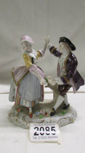 A Sitzendorf dancing couple figure group.