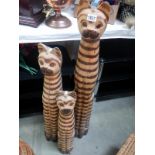 3 tall carved wooden cats