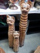 3 tall carved wooden cats