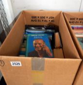 A box of books by and about actors Dirk Bogarde and David Niven.