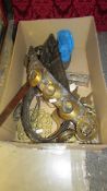 A mixed lot of brass and other metalware including horse brasses, trivets, toasting fork etc.,