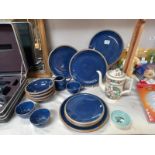 A quantity of blue plates, milk jug, sugar bowl etc.