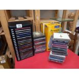 Some CD's with storage drawer chest and stacking pyramids