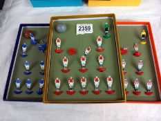 3 Subbuteo celluloid/card teams in modern holder boxes.