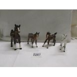 Four Beswick foals. in good condition.