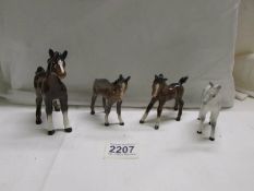 Four Beswick foals. in good condition.