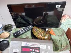 A 24" flat screen tv, 2 items of material and wooden duck egg holder COLLECT ONLY