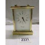 A superb quality heavy brass carriage clock by Woodford, missing key.