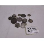 Twenty silver coins with holes, 61g