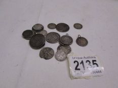 Twenty silver coins with holes, 61g