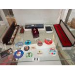 A quantity of miscellaneous items including badges, pens and watch etc