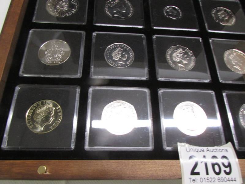 A cased collection of uncirculates/proof Elizabeth II commonwealth coins. - Image 4 of 5