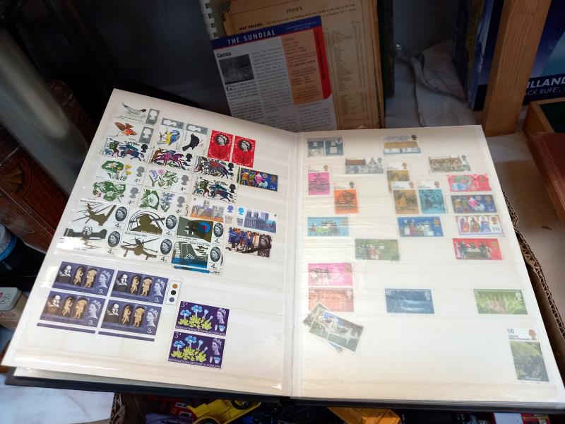 A collection of stamps in UK, & World albums of Jersey, Guernsey & some mint etc. - Image 7 of 7