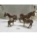 Three Beswick Donkeys and an unmarked donkey, all in good condition.