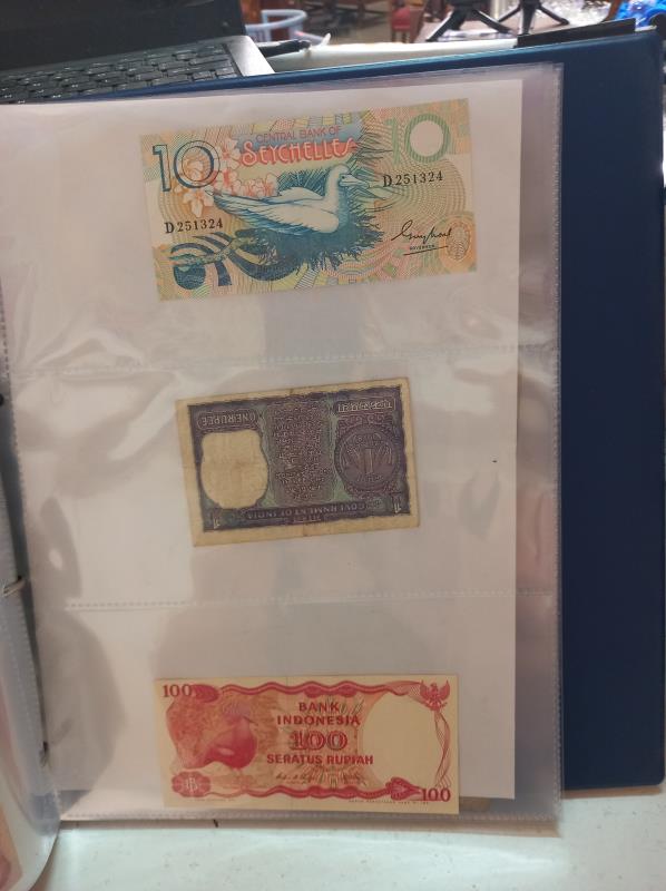 An album of approximately 86 world bank notes. - Image 23 of 26