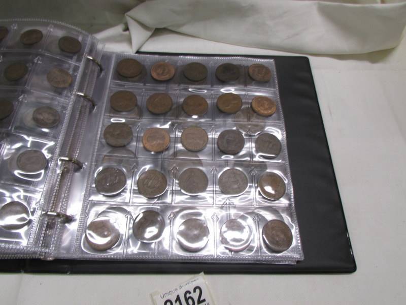 An album of in excess of 300 world coins. - Image 11 of 16