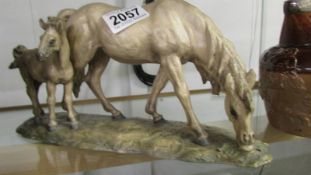 An Italian signed mid 20th century horse with foal, in good condition.