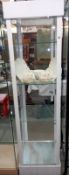 A metal framed white display cabinet ( Plastic sides, glass shelves, 48cm x 44cm x 175cm)