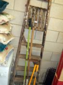 A wooden step ladder & garden tools