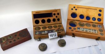 A selection of old brass boxed weights