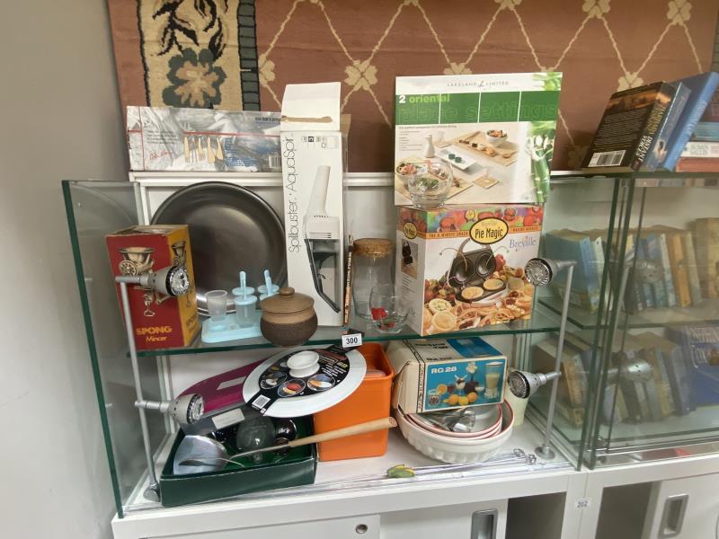 A mix of retro and modern kitchenware. 2 shelves