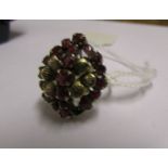 A yellow gold ring set garnets, marked 18k, (missing two stones), size N.