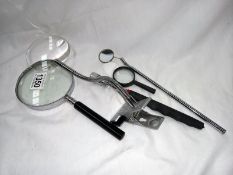A selection of magnifiers, a telescopic magnifier and mirror