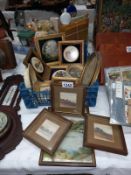 A tray of small gilded frames with pictures & pot lids