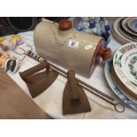 A stoneware footwarmer bottle, toasting fork, fire poker and 2 irons.