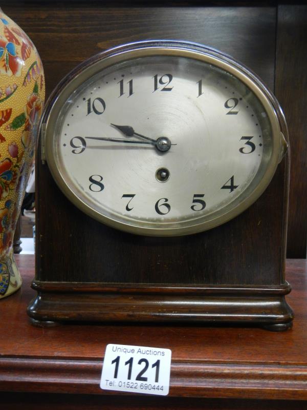 An early 20th century mahogany mantle clock in working order