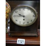 An early 20th century mahogany mantle clock in working order