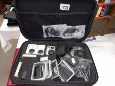 3 cased Go Pro cameras