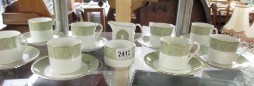 8 Royal Doulton Sonnet pattern tea cups and saucers and sugar and milk jug.