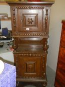 An early 20th century oak tall slim cupboard. COLLECT ONLY.