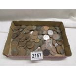 A quantity of old coins including pennies.