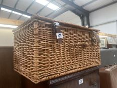 A wicker hamper basket