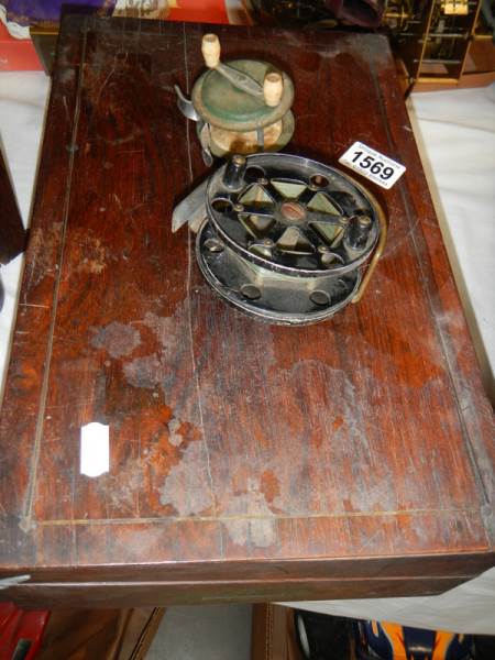 A quantity of vintage fishing reels etc., in a rosewood box. - Image 4 of 4